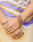 Set Of 9 Purple & Gold Beaded Stretch Bracelets